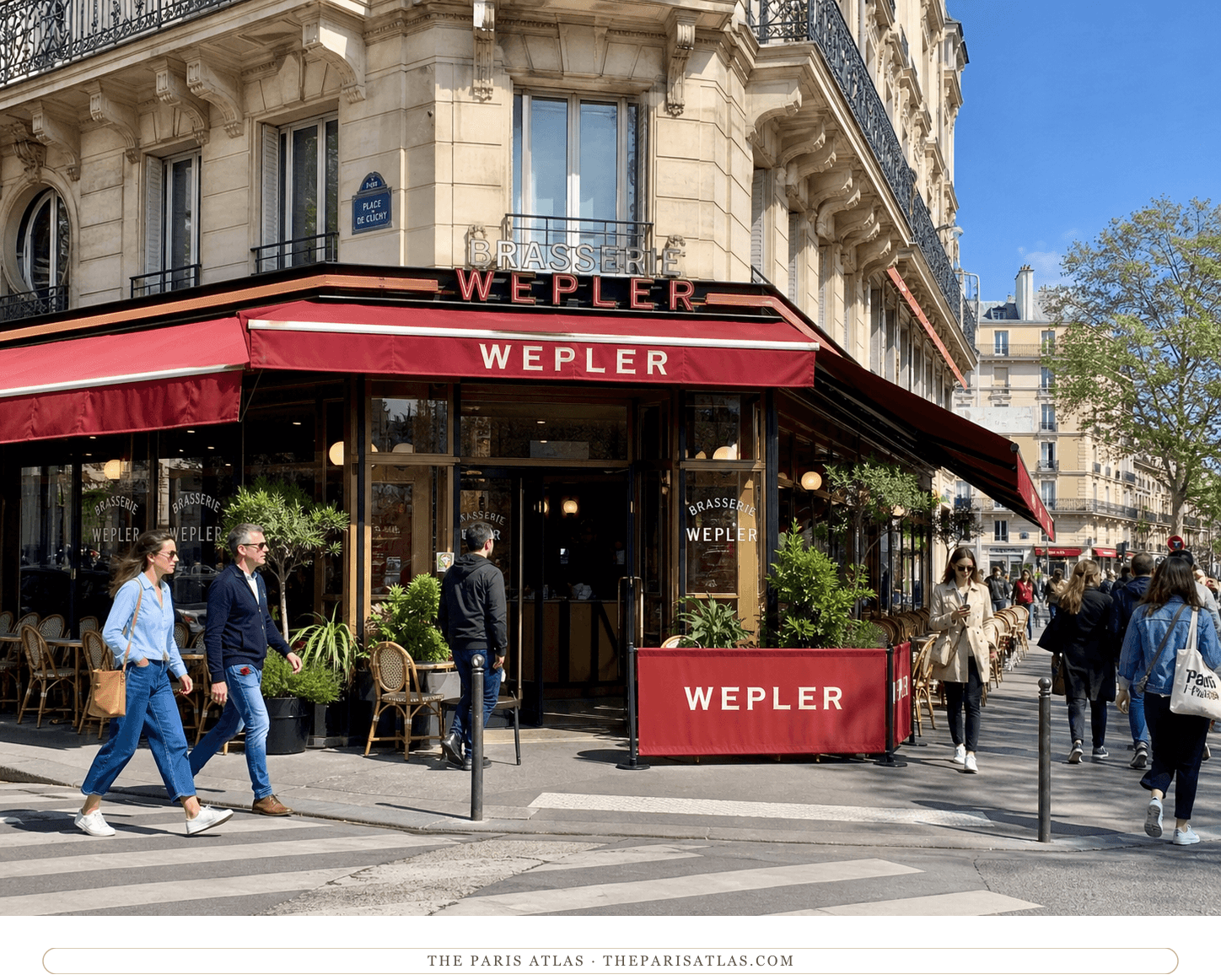 Bright color view of Wepler's red-awning facade beneath a blue Paris sky