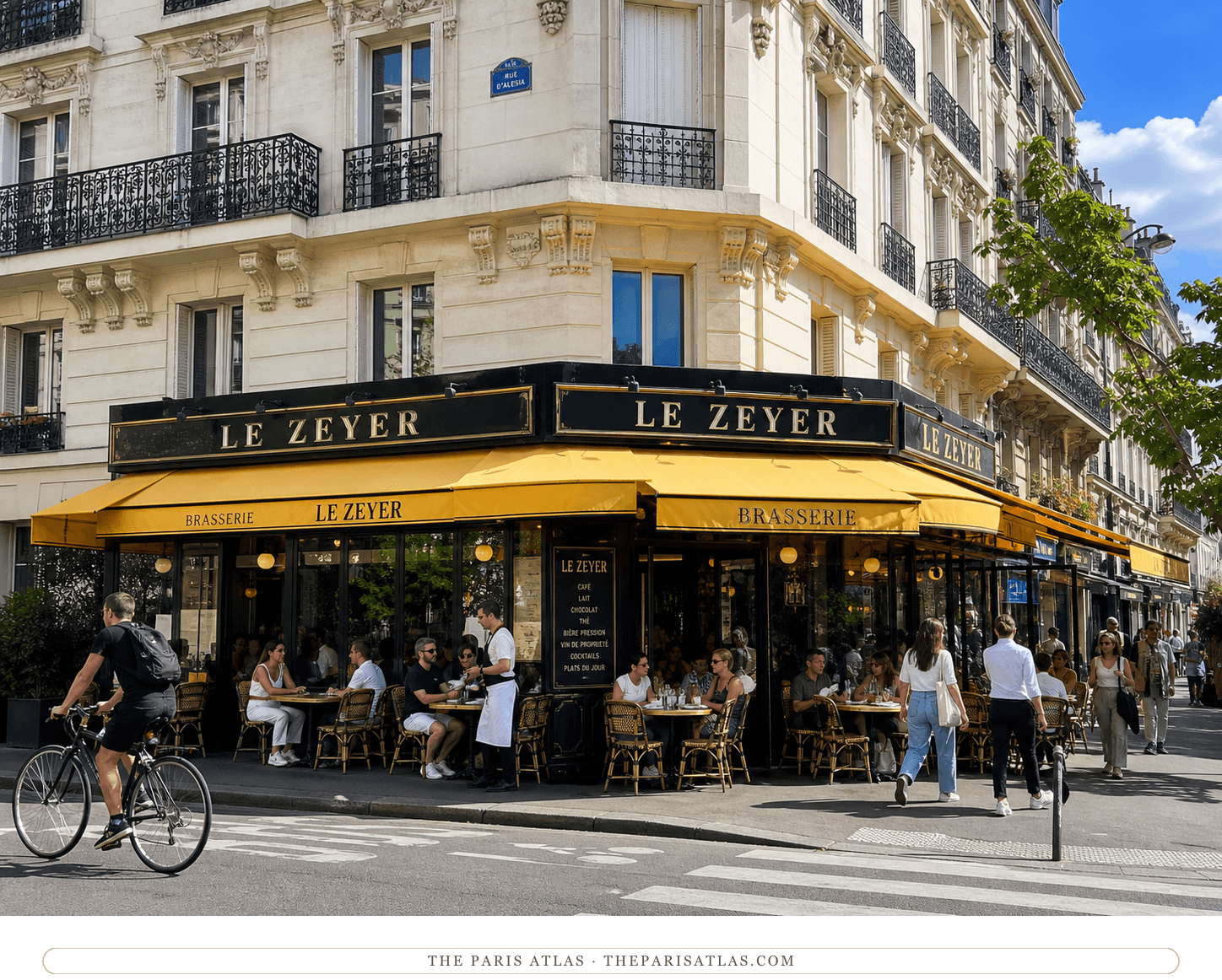 Bright present-day color view of Le Zeyer's yellow corner awnings and terrace