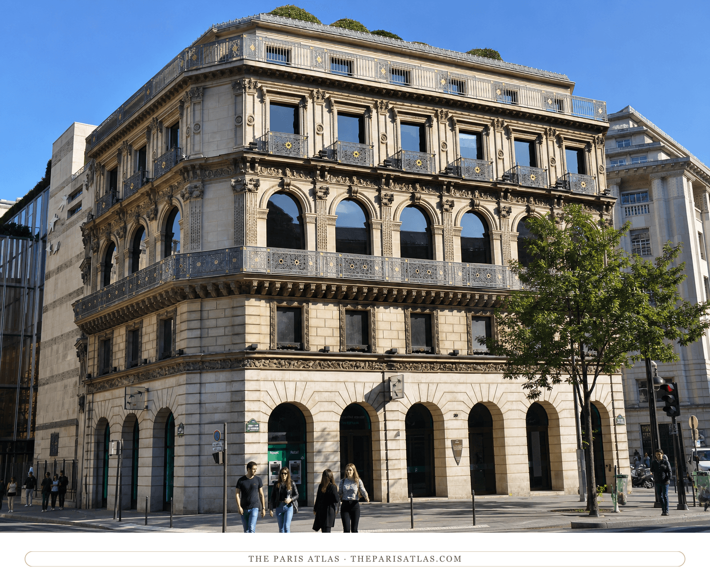 Sunlit present-day view of the Maison Dorée's pale stone and gilded balconies