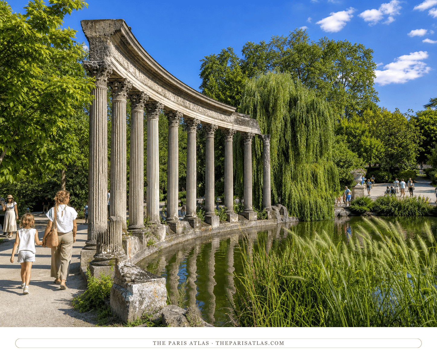 Present-day visitors beside the Naumachie colonnade and pond in Parc Monceau under a blue sky