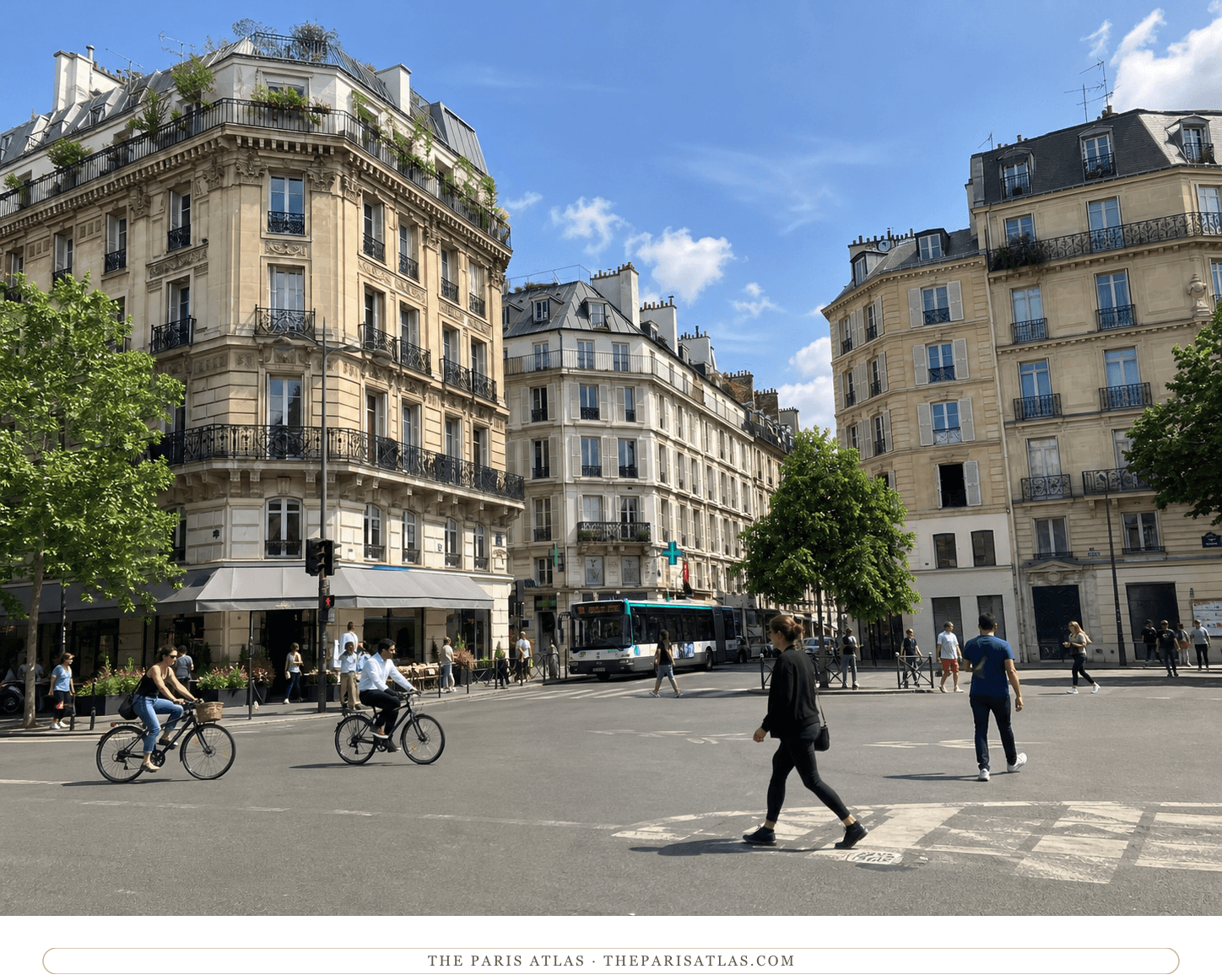 Bright present-day view of cyclists and pedestrians at Place Sartre-Beauvoir
