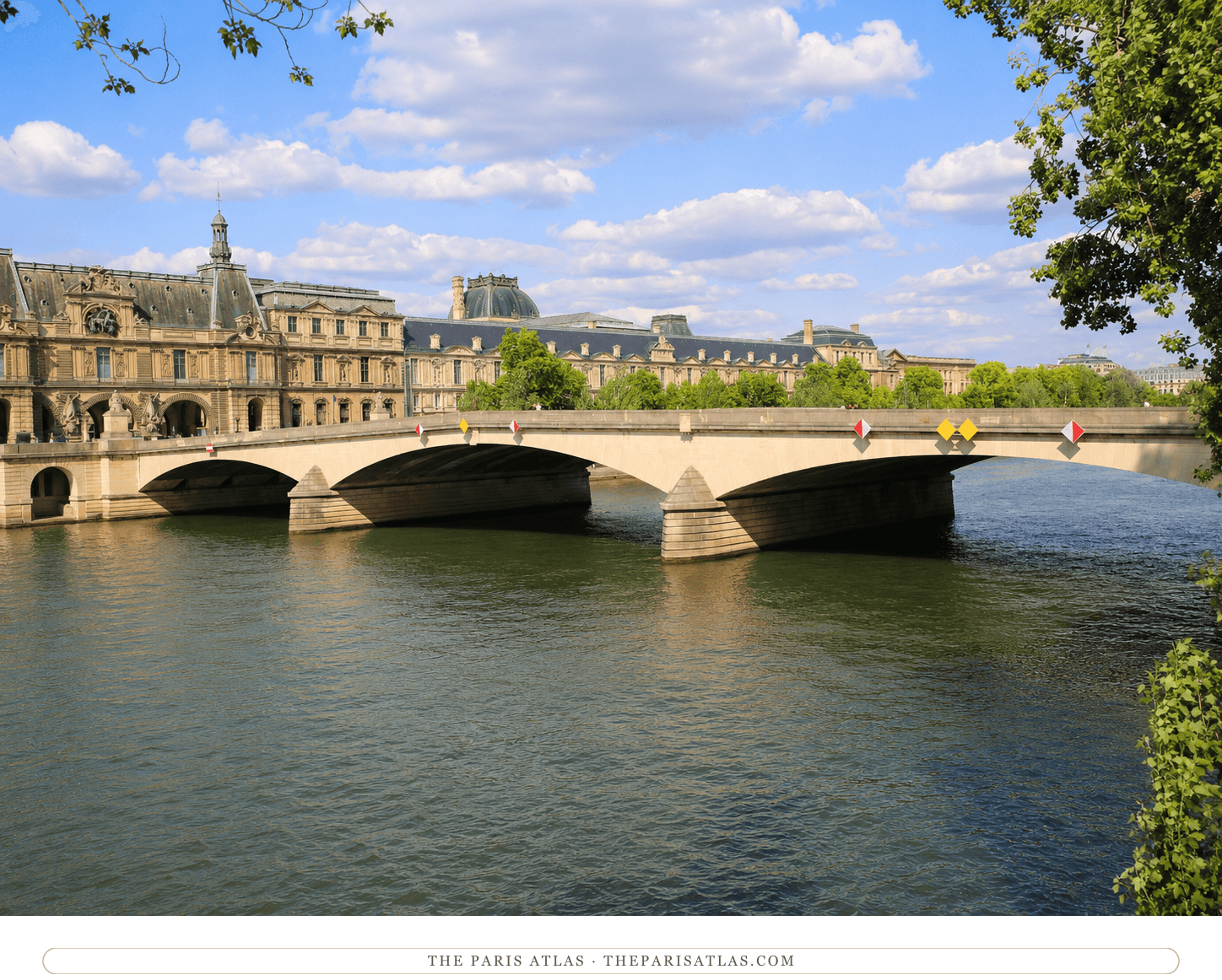 The same view in colour, pale stone arches over green water under a blue sky