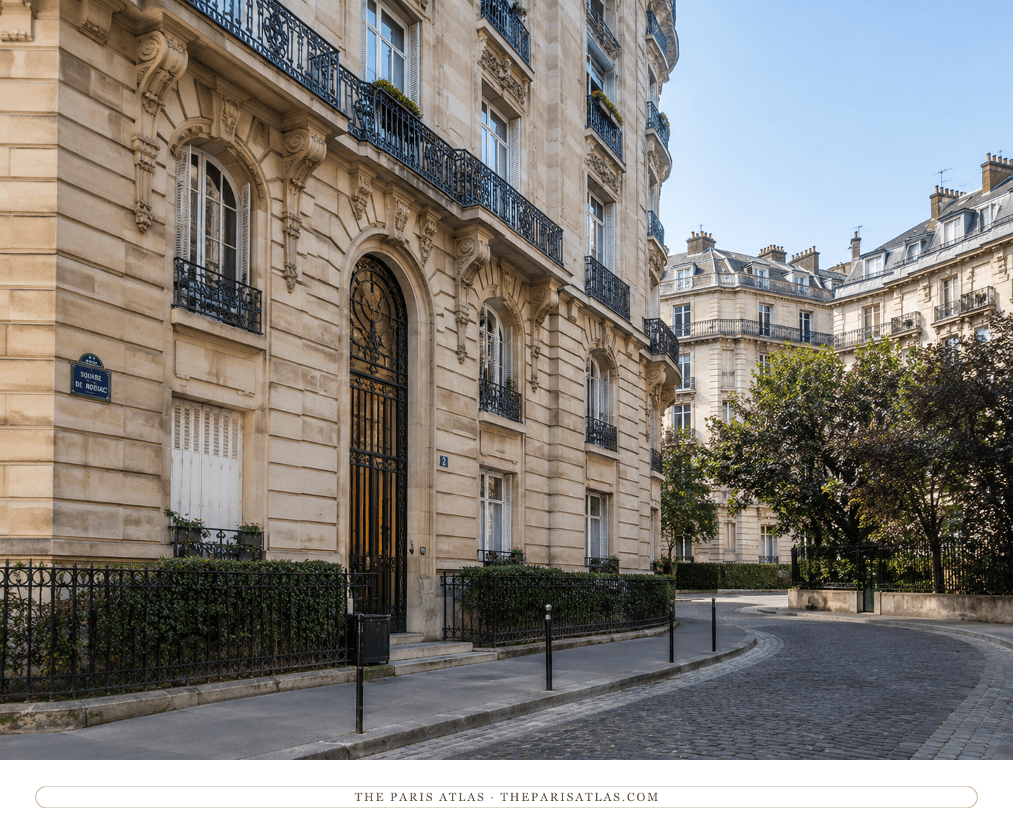The Square de Robiac in soft daylight, pale stone and cobbles curving past the doorway of No. 2