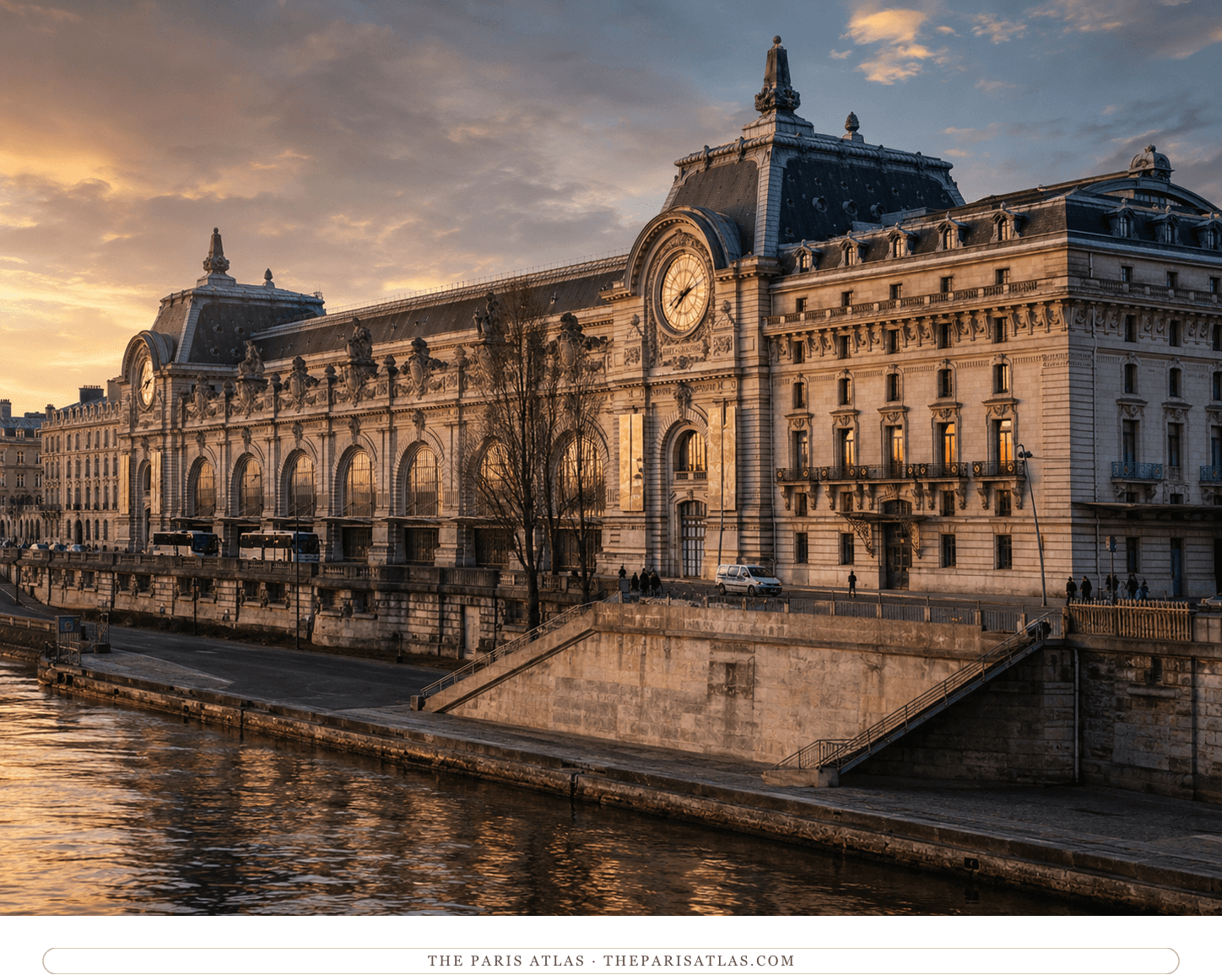 The Orsay building at sunset from across the Seine, golden light on the stone façade and the river in the foreground
