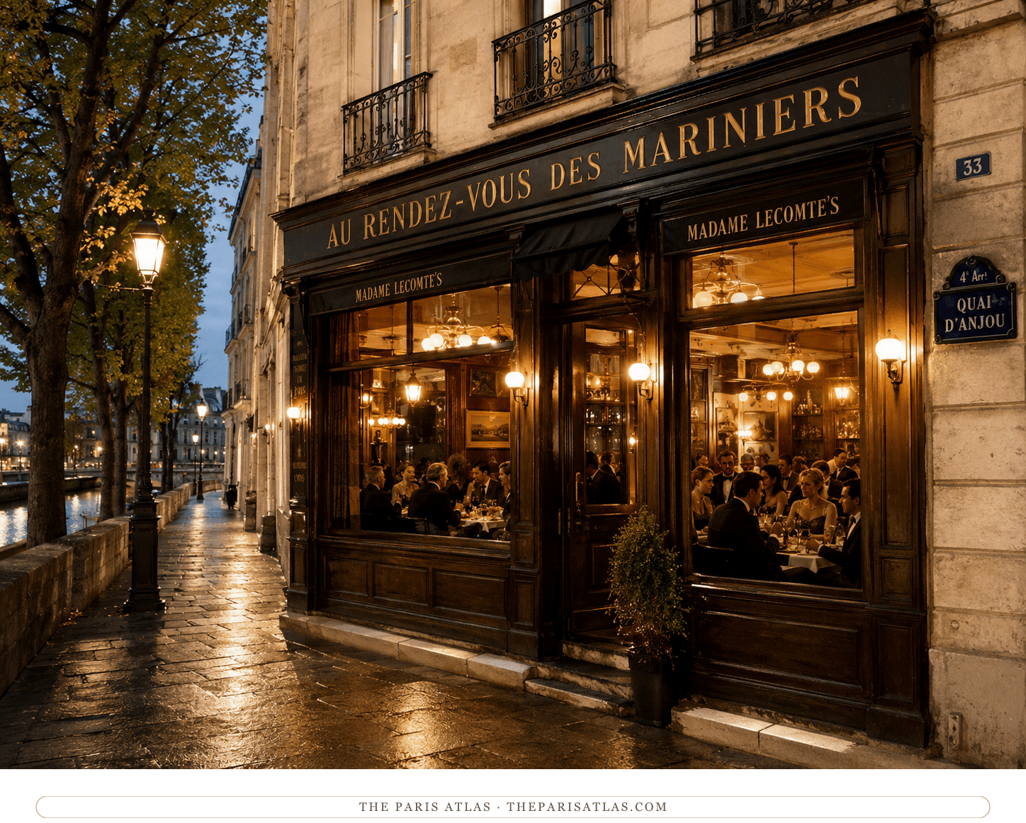 The riverside restaurant at dusk, warm light spilling from its windows onto the wet quai beside the Seine