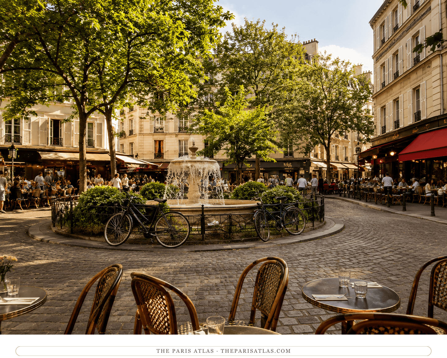 The Place de la Contrescarpe in summer light, the fountain playing at the center and café terraces ringing the cobbles