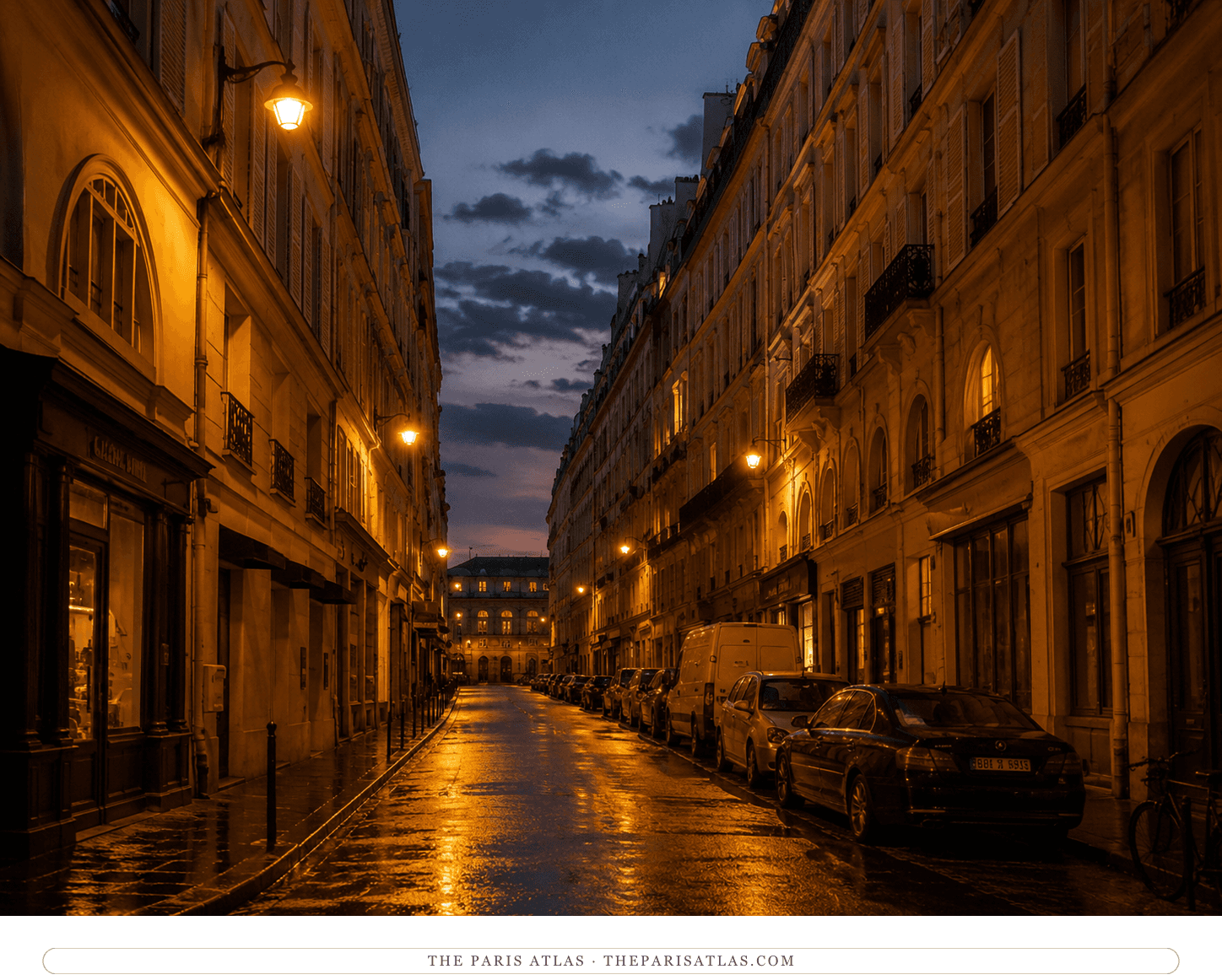 The Rue Bonaparte at nightfall, amber lamps and a violet sky over the wet street