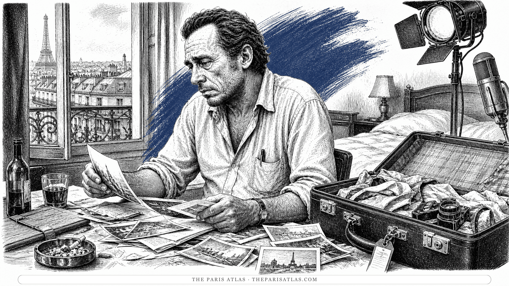 Charles Bukowski sorting travel photographs and papers in a Paris hotel room with an open suitcase, television light, microphone and rooftops beyond the window.