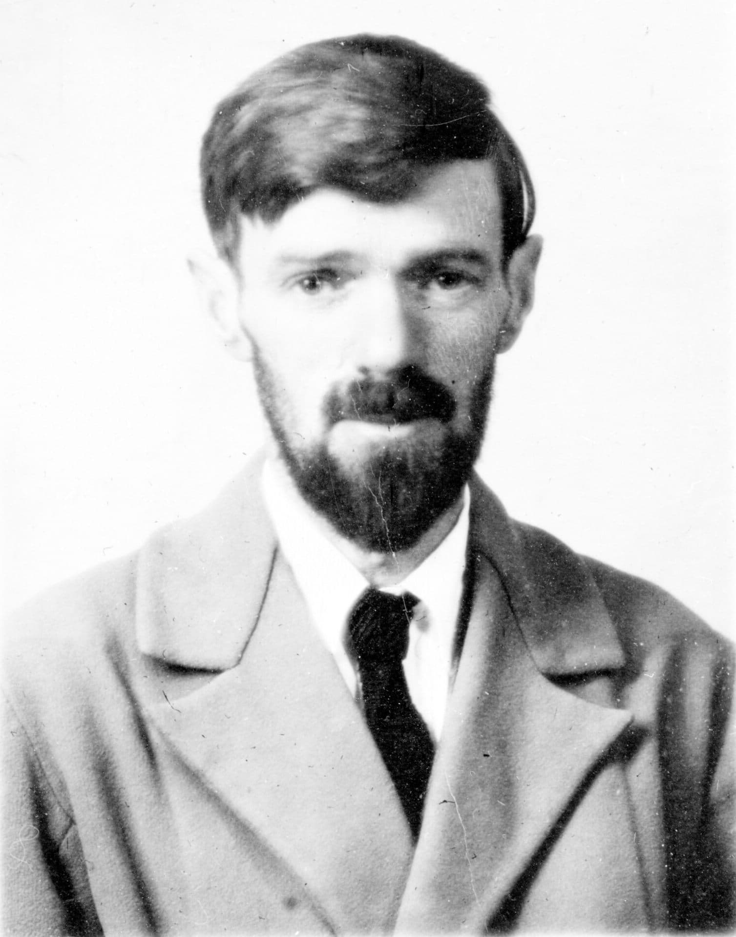 Passport photograph of D. H. Lawrence, bearded and in an overcoat, taken on 22 February 1929.