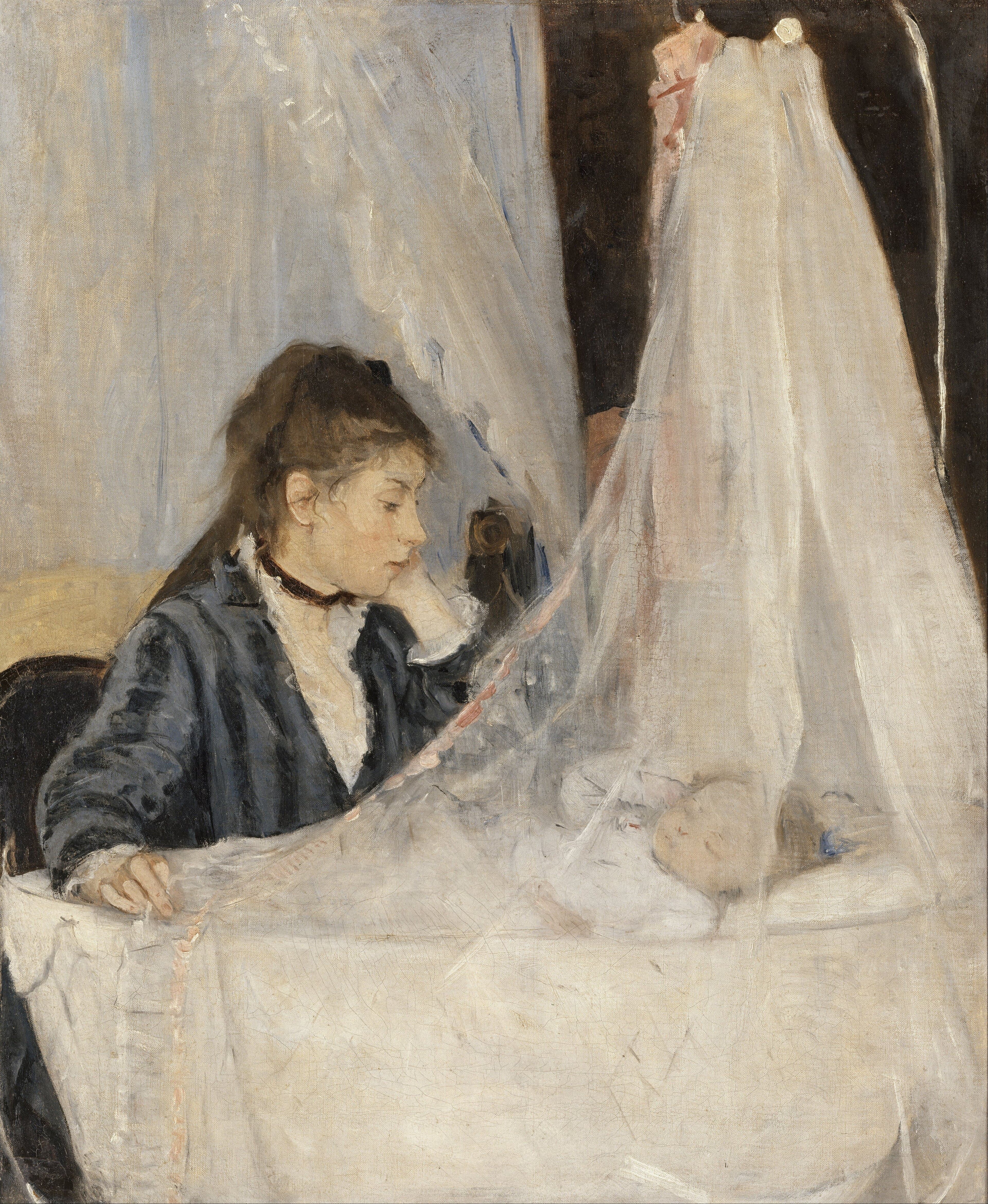 A mother in dark blue watching her sleeping infant through a veil of white muslin