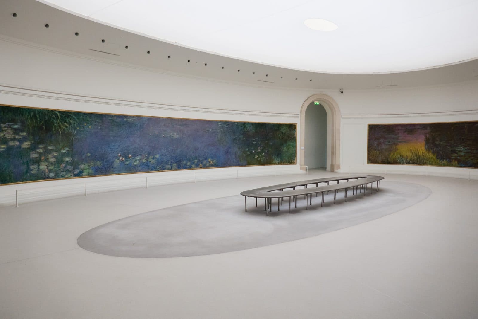 One of the two oval Water Lilies rooms at the Musée de l'Orangerie, curved canvases on both walls under a diffused skylight