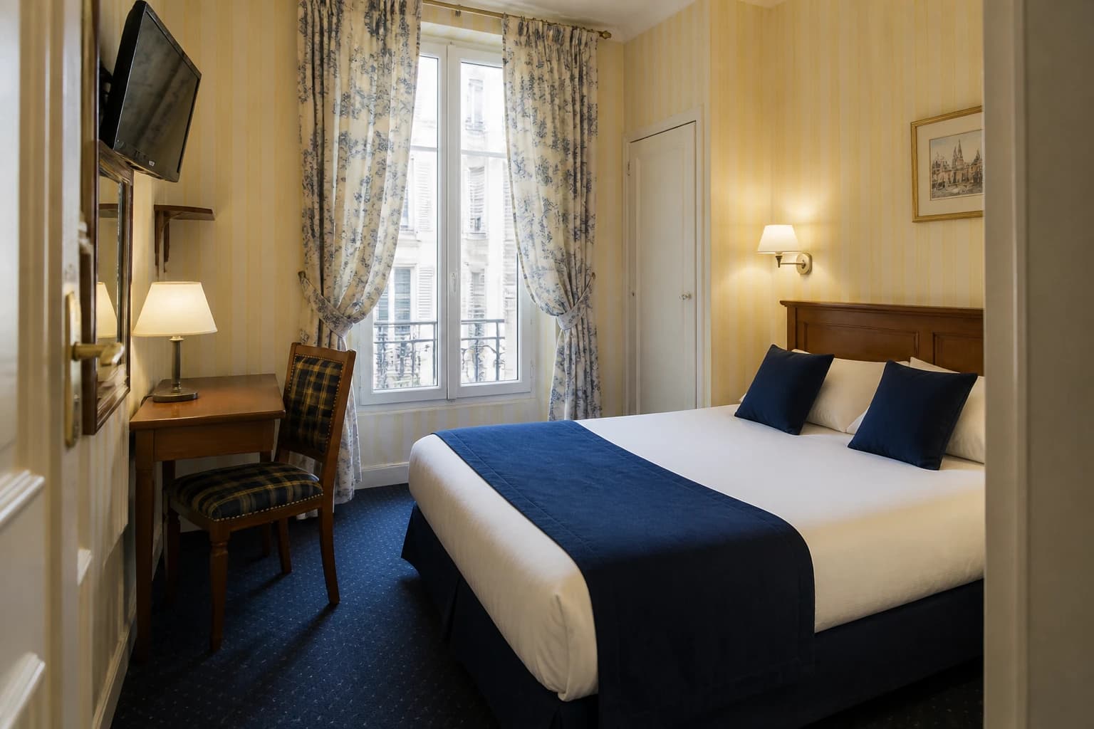 Editorial illustration of a compact Hôtel Delambre room with white bedding, navy accents, striped wallpaper, a wood desk, and a plaid chair.