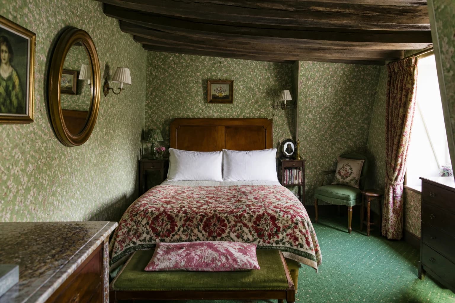 Editorial illustration of a quirky Hôtel Esmeralda room with green floral wallpaper, exposed beams, antique wood furniture, and layered textiles.