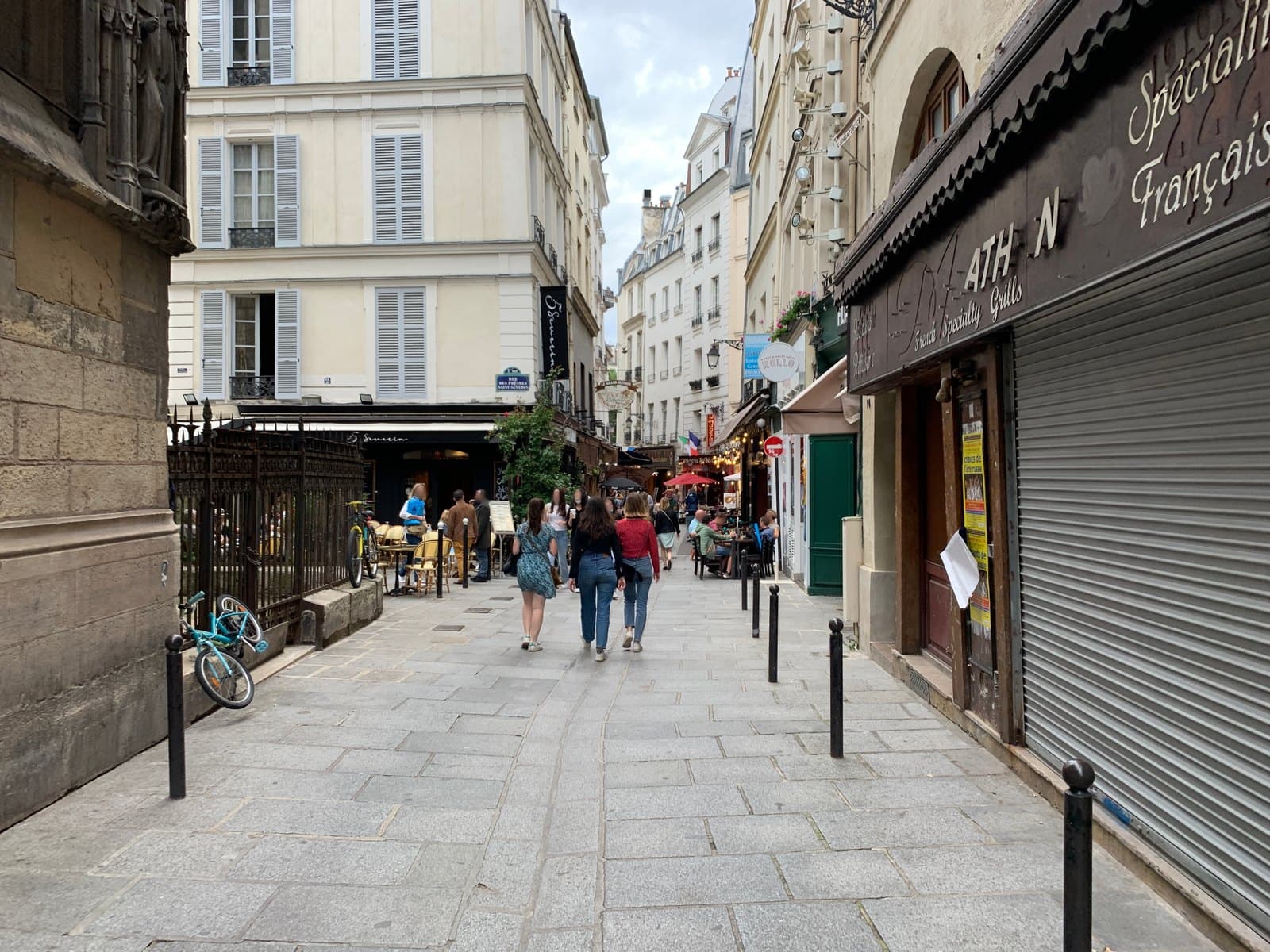 Pedestrians and cafés on rue Saint-Séverin near Hôtel Europe Saint-Séverin.
